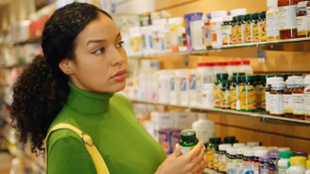 woman-looking-at-store-supplements